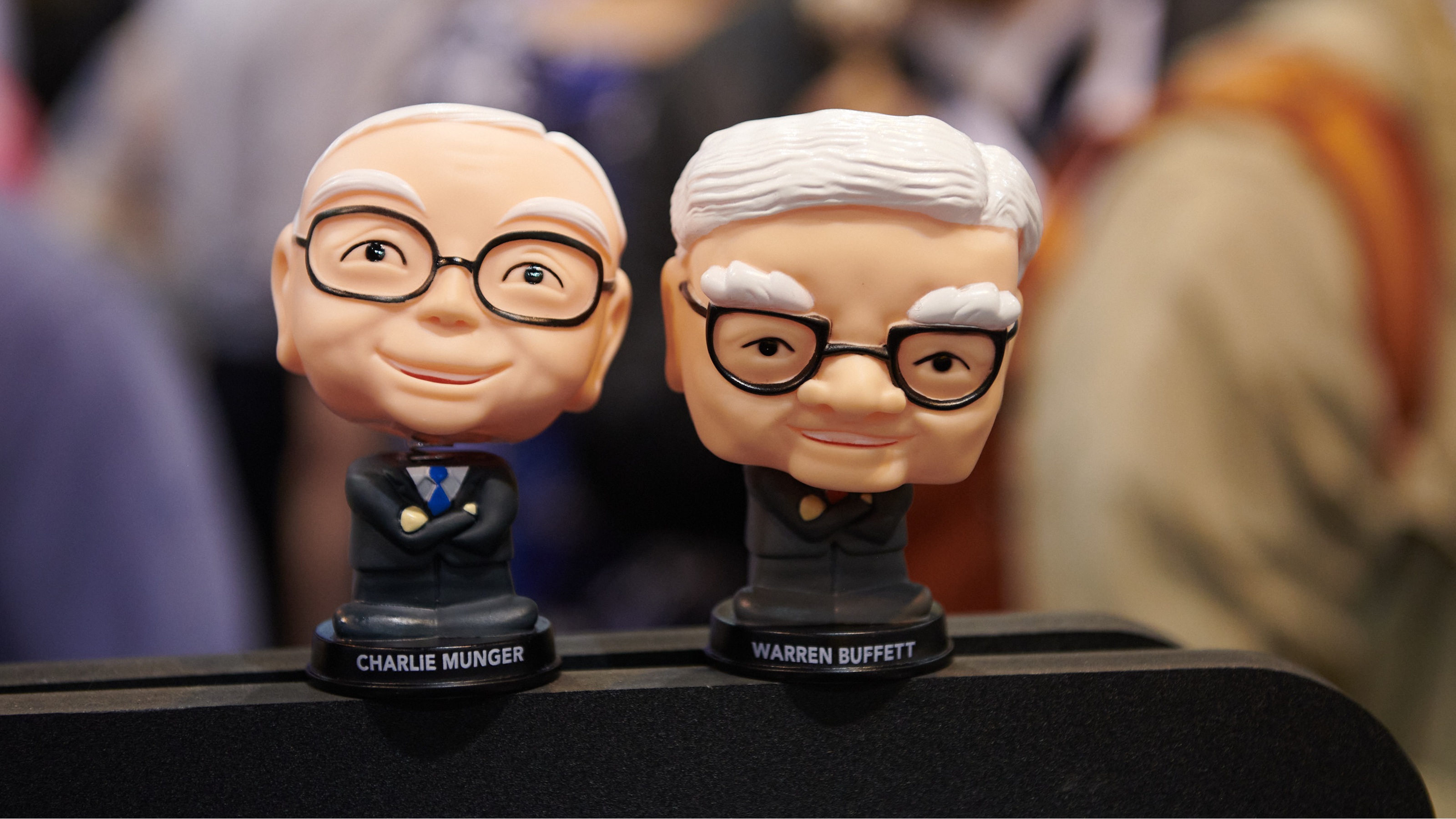 Bobbleheads depict Berkshire Hathaway CEO Warren Buffett and former vice chairman Charlie Munger.