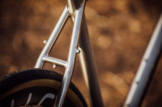 Image shows the frame clearance with a gravel bike tire