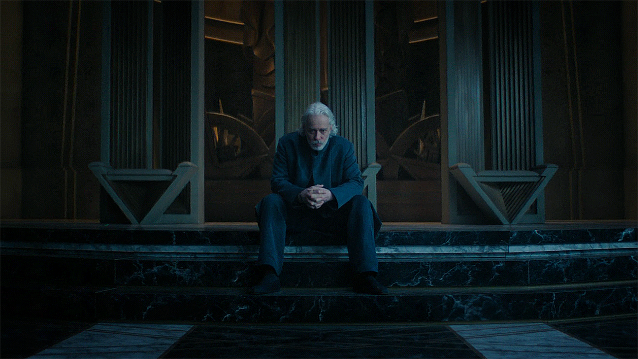 Brother Dusk sitting forlornly in Empire's throne room in Foundation season 3 episode 9