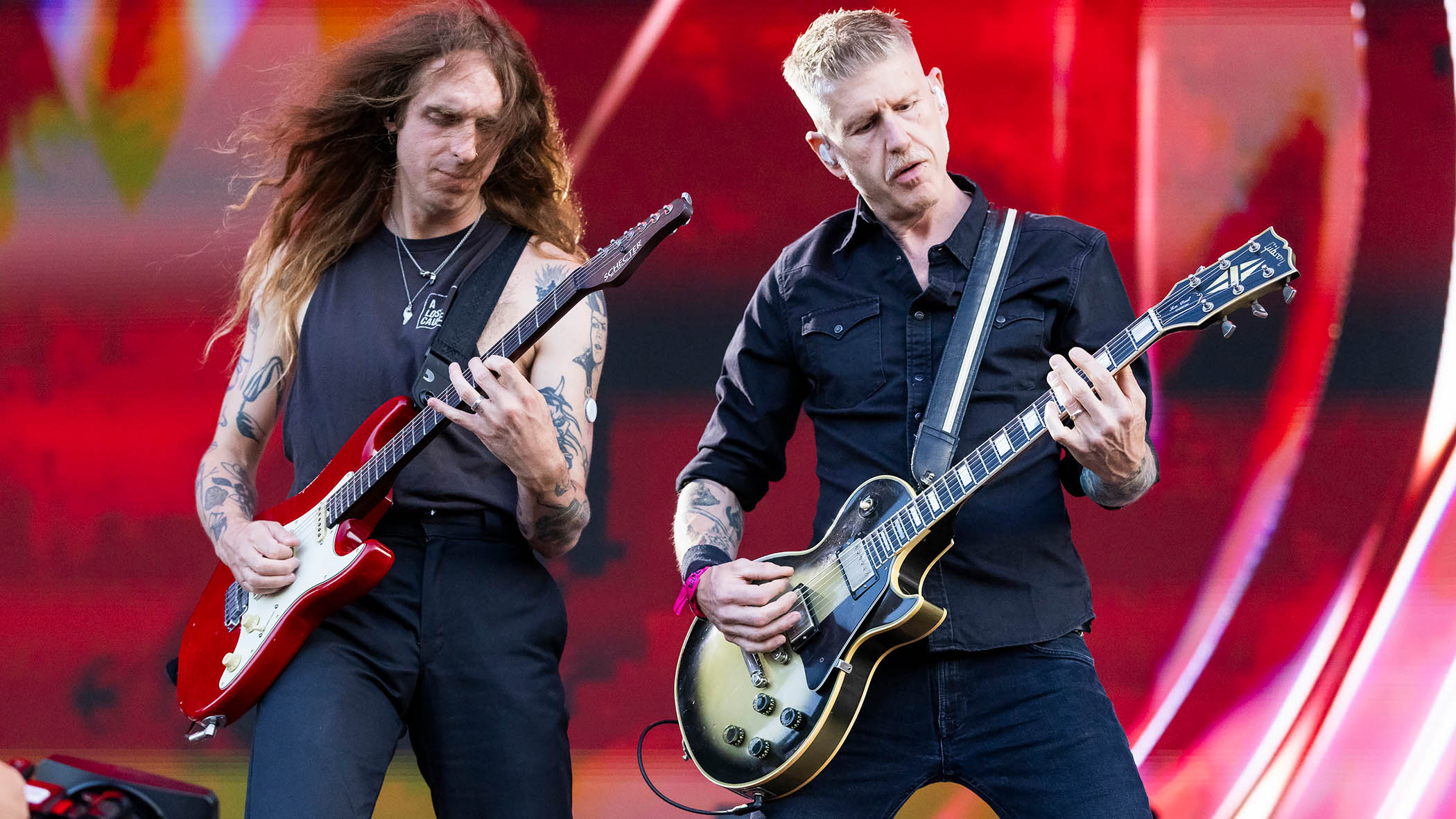 Nick Johnston and Bill Kelliher perform live during a Mastodon festival show.