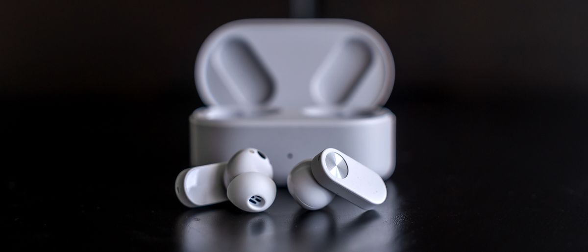 Hero image of OnePlus Nord Buds 2 earbuds with case behind.