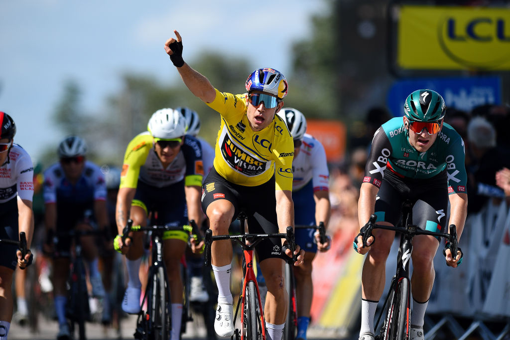 CHAINTRE FRANCE JUNE 09 Wout Van Aert of Belgium and Team Jumbo Visma Yellow Leader Jersey celebrates winning ahead of Jordi Meeus of Belgium and Team Bora Hansgrohe during the 74th Criterium du Dauphine 2022 Stage 5 a 1623km stage from ThizylesBourgs to Chaintr WorldTour Dauphin on June 09 2022 in Chaintre France Photo by Dario BelingheriGetty Images