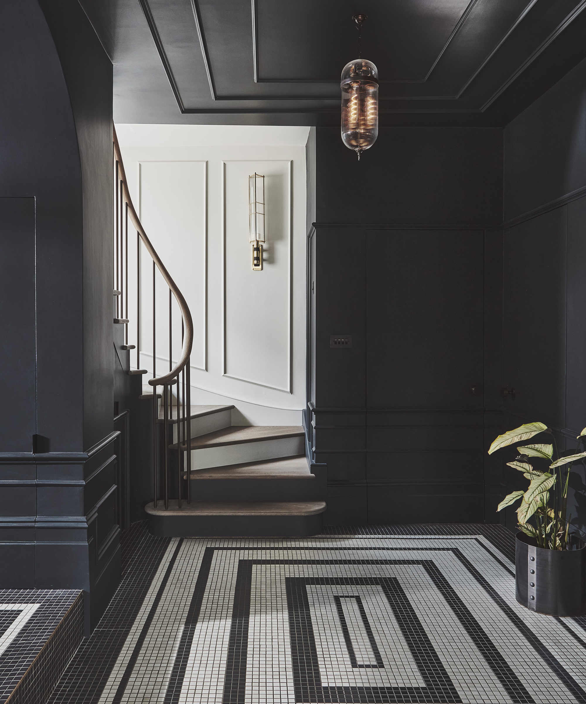 black paint hallway with black and white mosaic floor