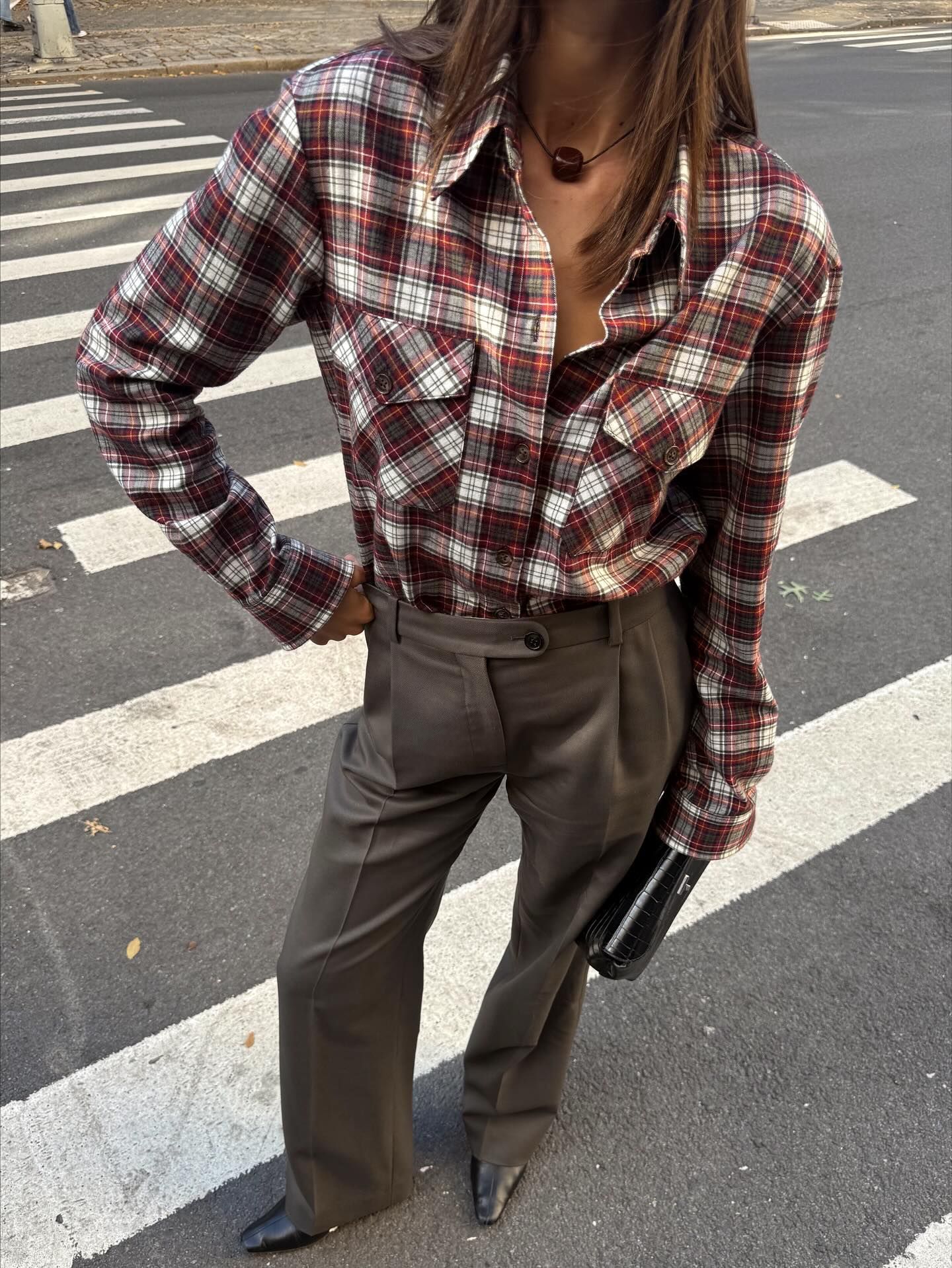 @maiacotton wearing a flannel shirt with gray tailored trousers.