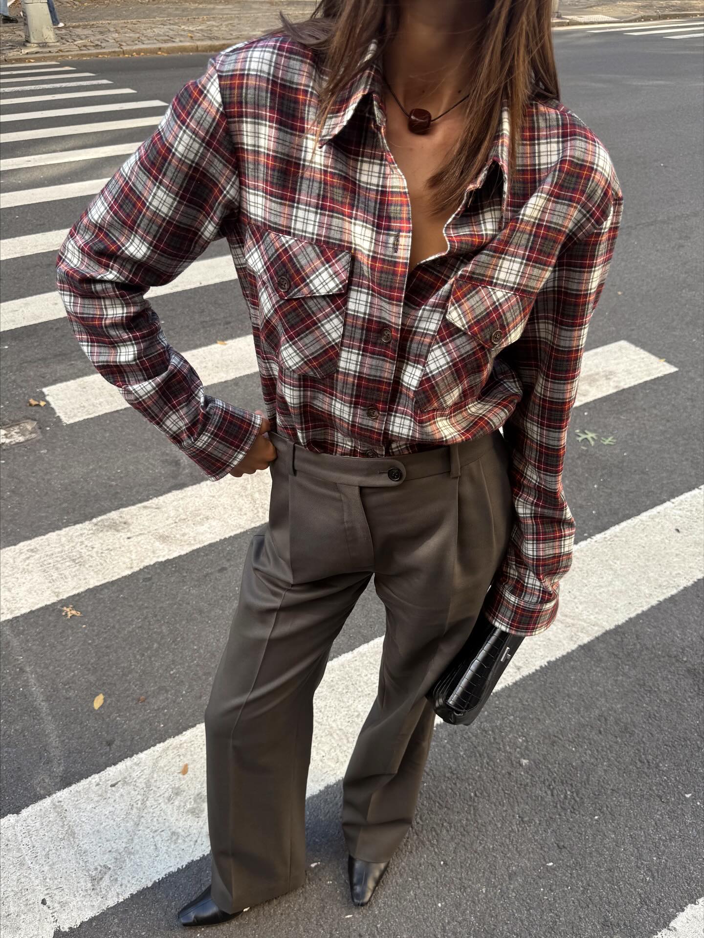 @maiacotton wearing a flannel shirt with gray tailored trousers.