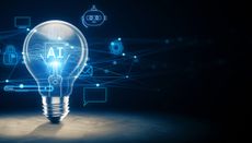 The word "AI" lit up inside a lightbulb with various icons surrounding it including one for email and robots