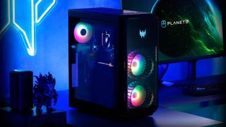 Acer Predator Orion 7000, one of the best gaming PCs, on a desk with the RGB fans running