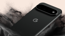 Google Pixel 11 Pro in black on a light background dropped into sand