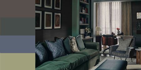 winter color palette in a modern living room, color-drenched in dark green with dark green velvet sofa, dark blue cushions and ottoman, dark-colored sheer curtains, an armchair with a patterned cushion
