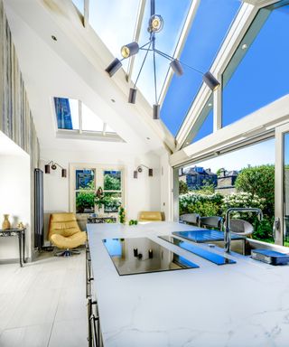 open plan kitchen conservatory with white vaulted roof