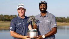Tom Hoge and Sahith Theegala with the trophy after winning the 2022 QBE Shootour