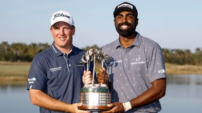 Tom Hoge and Sahith Theegala with the trophy after winning the 2022 QBE Shootour