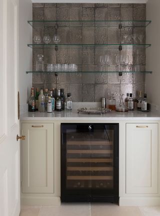 Small home bar with gray wallpaper