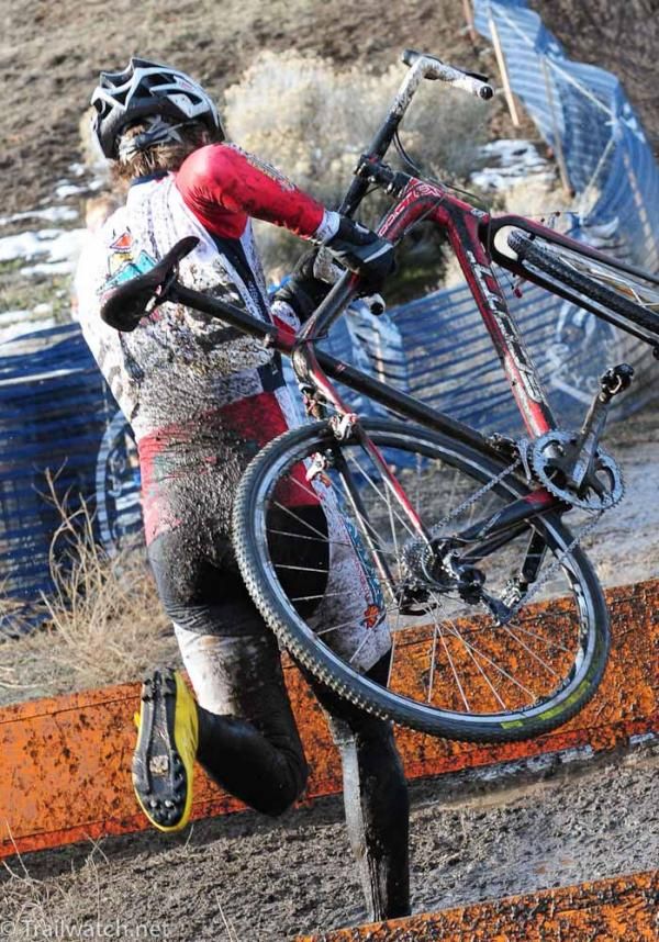 Eric Thompson (Maplelag - Paramount Sports) high-stepping over the barriers