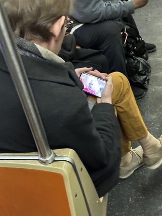 Alleged live image of someone using the Pixel Fold on a train