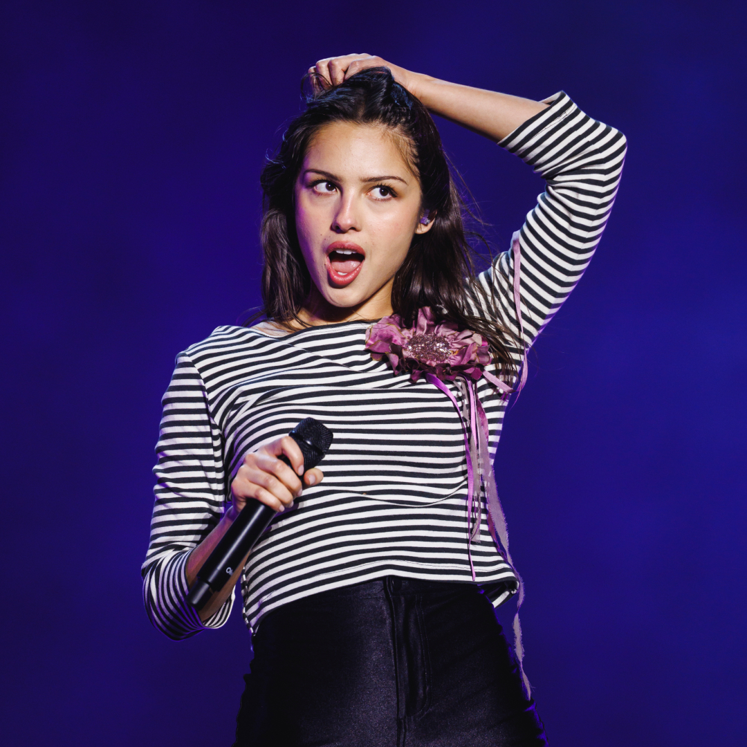 Olivia Rodrigo performs during Primavera Sound 2026 at Parc Del Forum in Barcelona, Spain on June 6, 2026 wearing black hot pants, a striped breton top, and knee-high Dr Martens boots