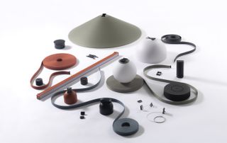 The Plusminus lighting collection shown as a toolkit, with the different elements comprising it shown separately, including the textile bands, connecting elements and lights