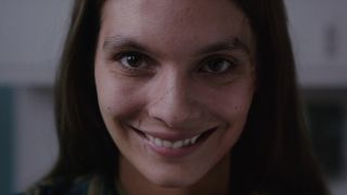 A close up shot of a woman creepily smiling in Paramount's Smile film