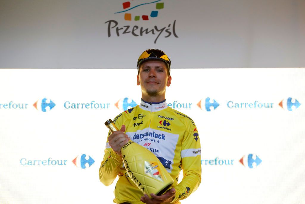 PRZEMYSL POLAND AUGUST 10 Joo Pedro Gonalves Almeida of Portugal and Team Deceuninck QuickStep Yellow Leader Jersey celebrates at Podium during the 78th Tour de Pologne 2021 Stage 2 a 201km stage from Zamo to Przemyl 341m TourdePologne TDP2021 UCIWT on August 10 2021 in Przemysl Poland Photo by Bas CzerwinskiGetty Images