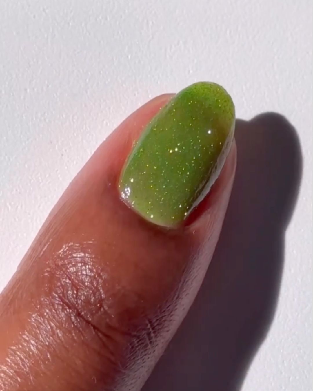 Sparkly green nail polish.