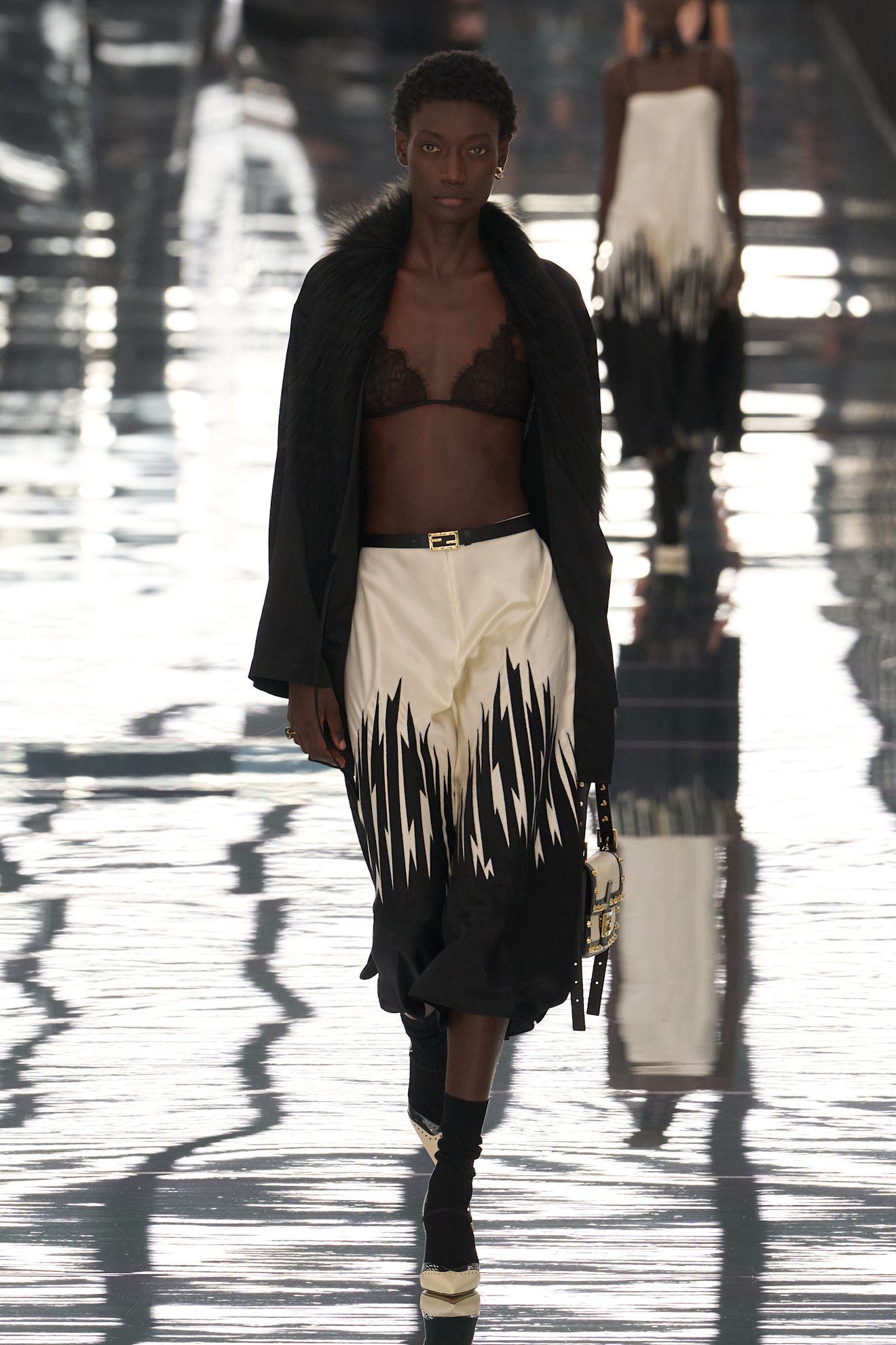 Spring/summer 2027 model wearing a bra top on the runway during fashion month.
