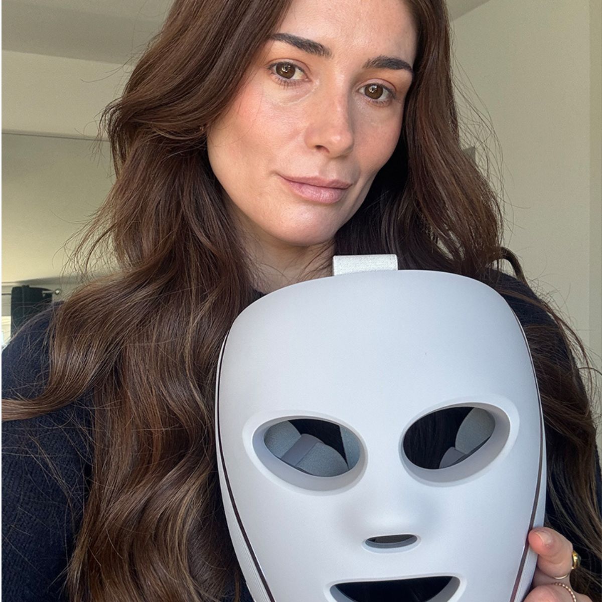 Eleanor holding the shark LED mask
