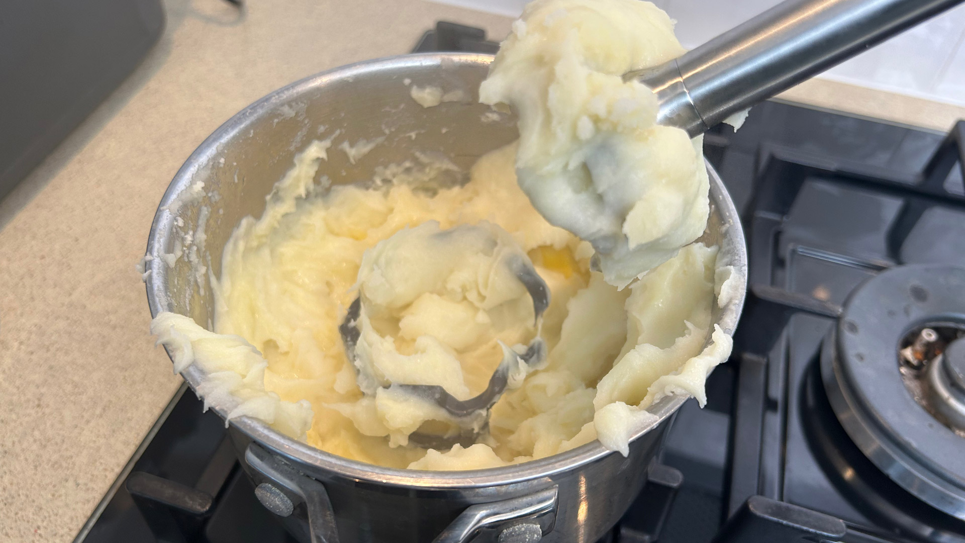 The KitchenAid Go Cordless Hand Blender's pan protector comes off and gets chopped while making potato puree