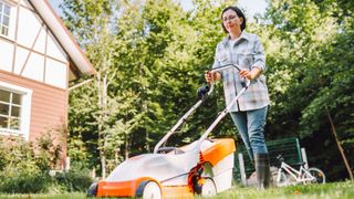 A woman mowing her lawn