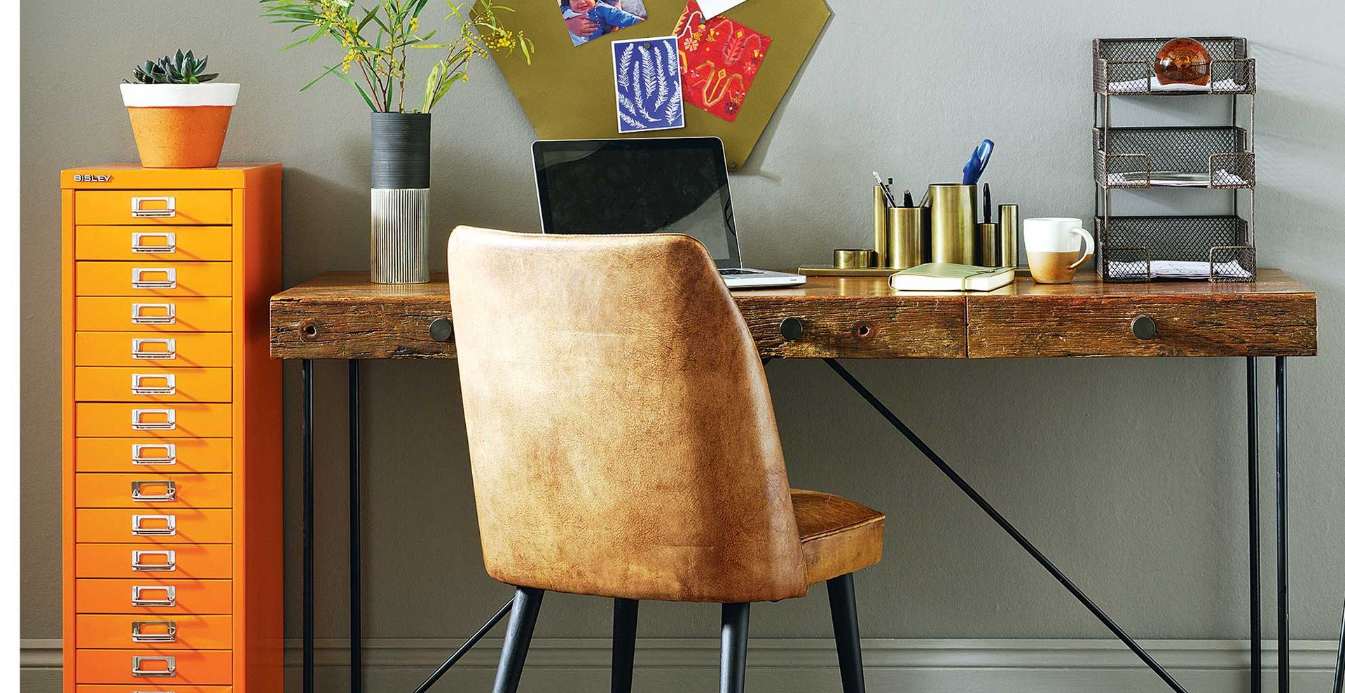 dark grey home office with brown leather chair