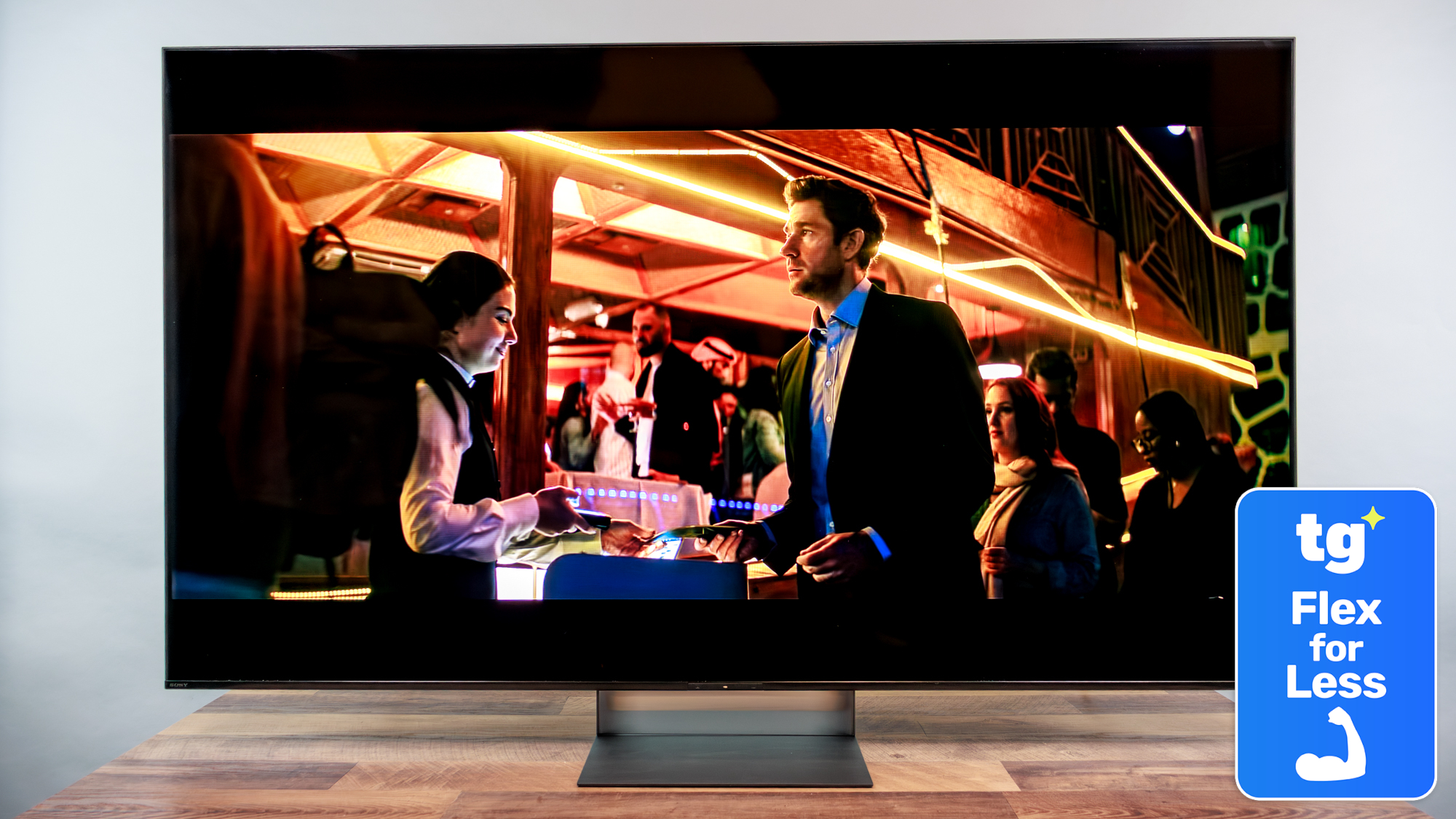 The Sony Bravia 7 II displaying colorful, cinematic content alongside a super-imposed badge that reads: "TG Flex for Less"