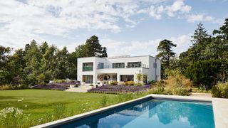 white self build with modern swimming pool