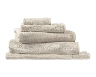 Sheridan Designer Style Living Textures Cotton Bath Towels in beige, 5 stacked towels