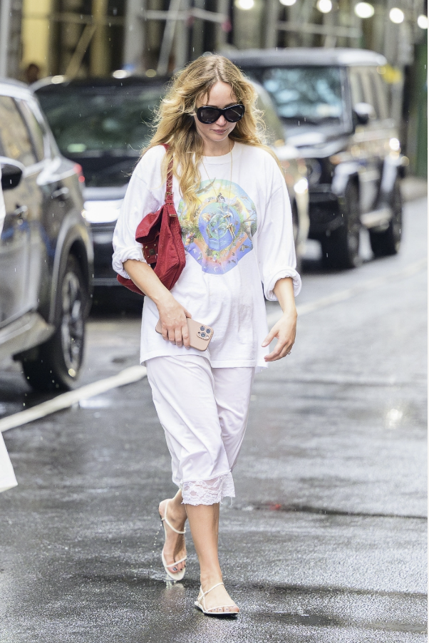 jennifer lawrence wearing a t-shirt and lace-trimmed skirt
