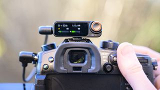 Dji Mic 2 receiver mounted to a mirrorless camera