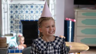 Elodie Blomfield as Phoebe, wearing a party hat, in Ted Lasso season 3 episode 10 "International Break"