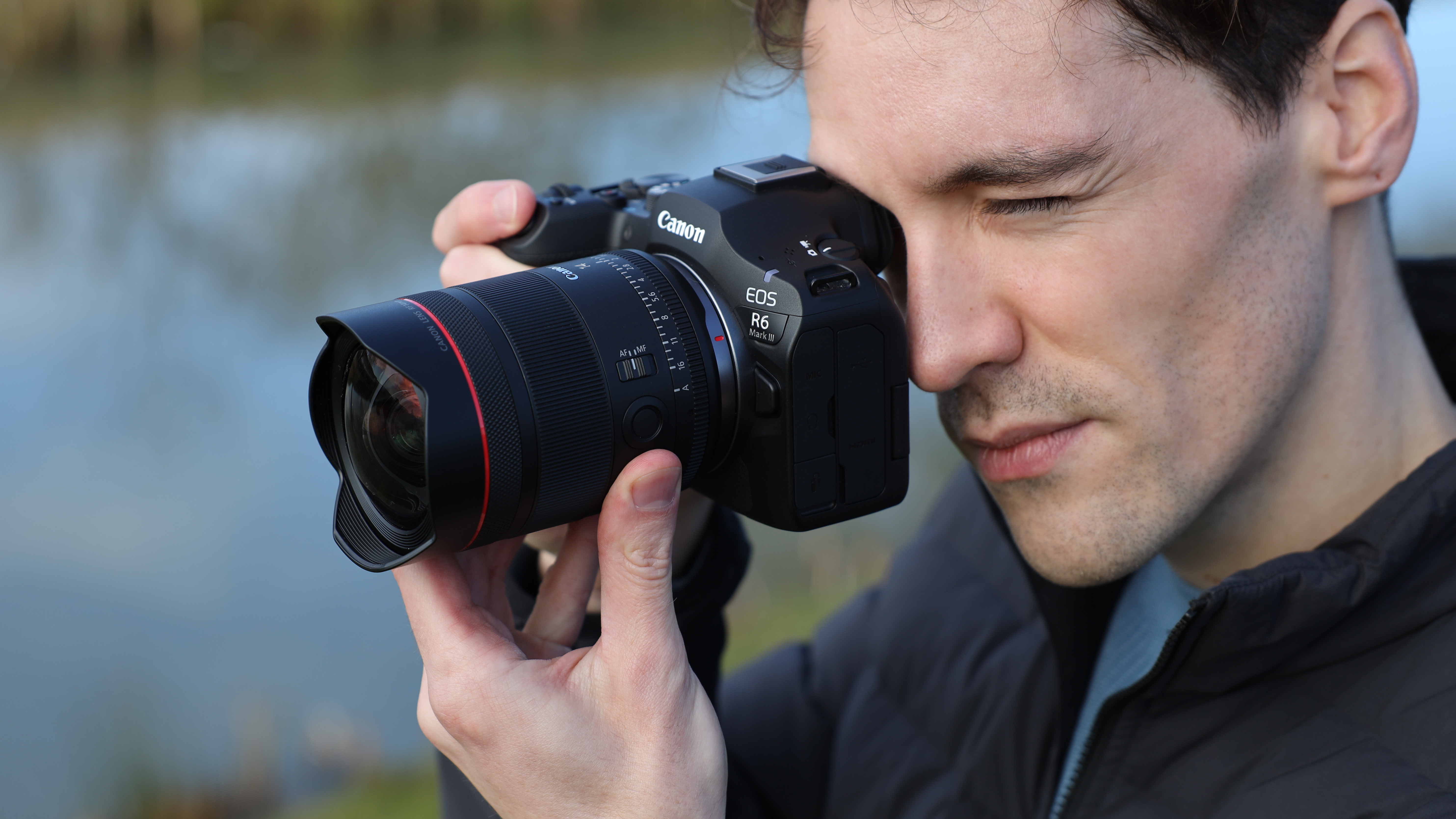 Canon EOS R6 Mark III camera with Canon RF 14mm f/1.4L VCM lens attached held in a pair of hands