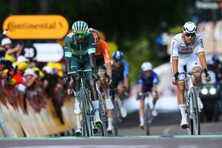 Biniam Girmay, Michael Matthews and Mathieu van der Poel battle it out in the chase group on stage nine of the Tour de France 2024.