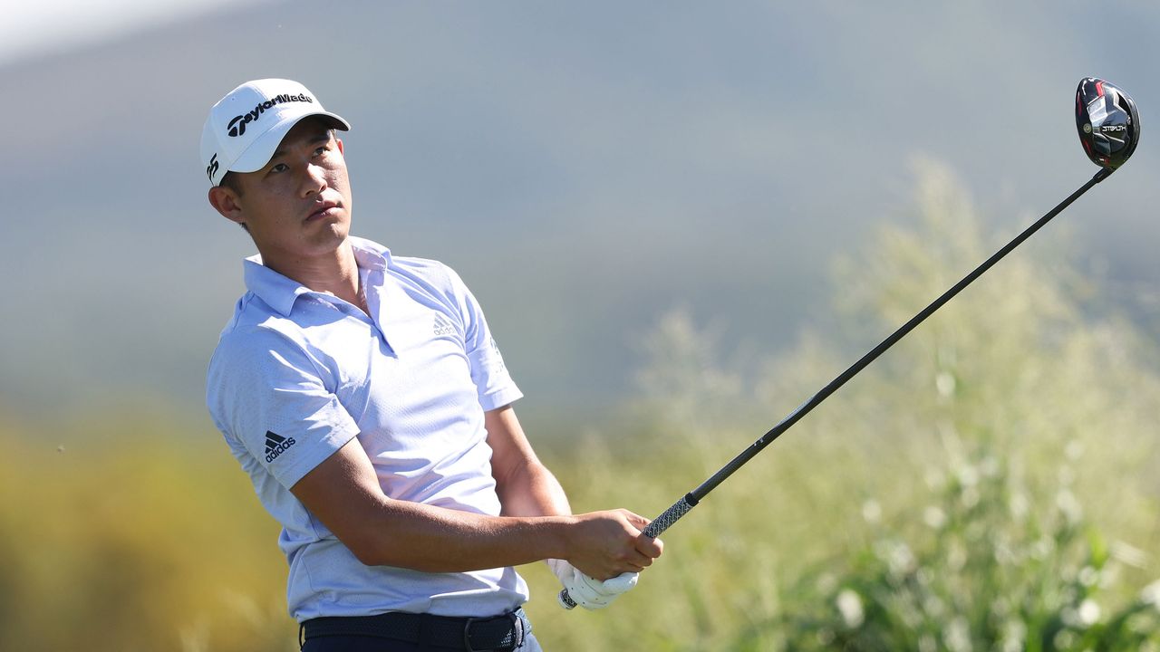 Collin Morikawa watches his shot after hitting a drive