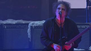 Robert Smith onstage with The Cure