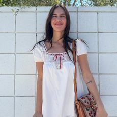 An image of @devonleecarlson wearing a music festival outfit.