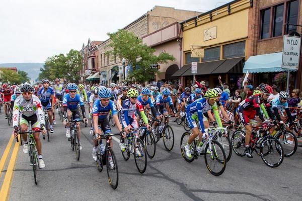 The peloton rolls out of downtown Durango.