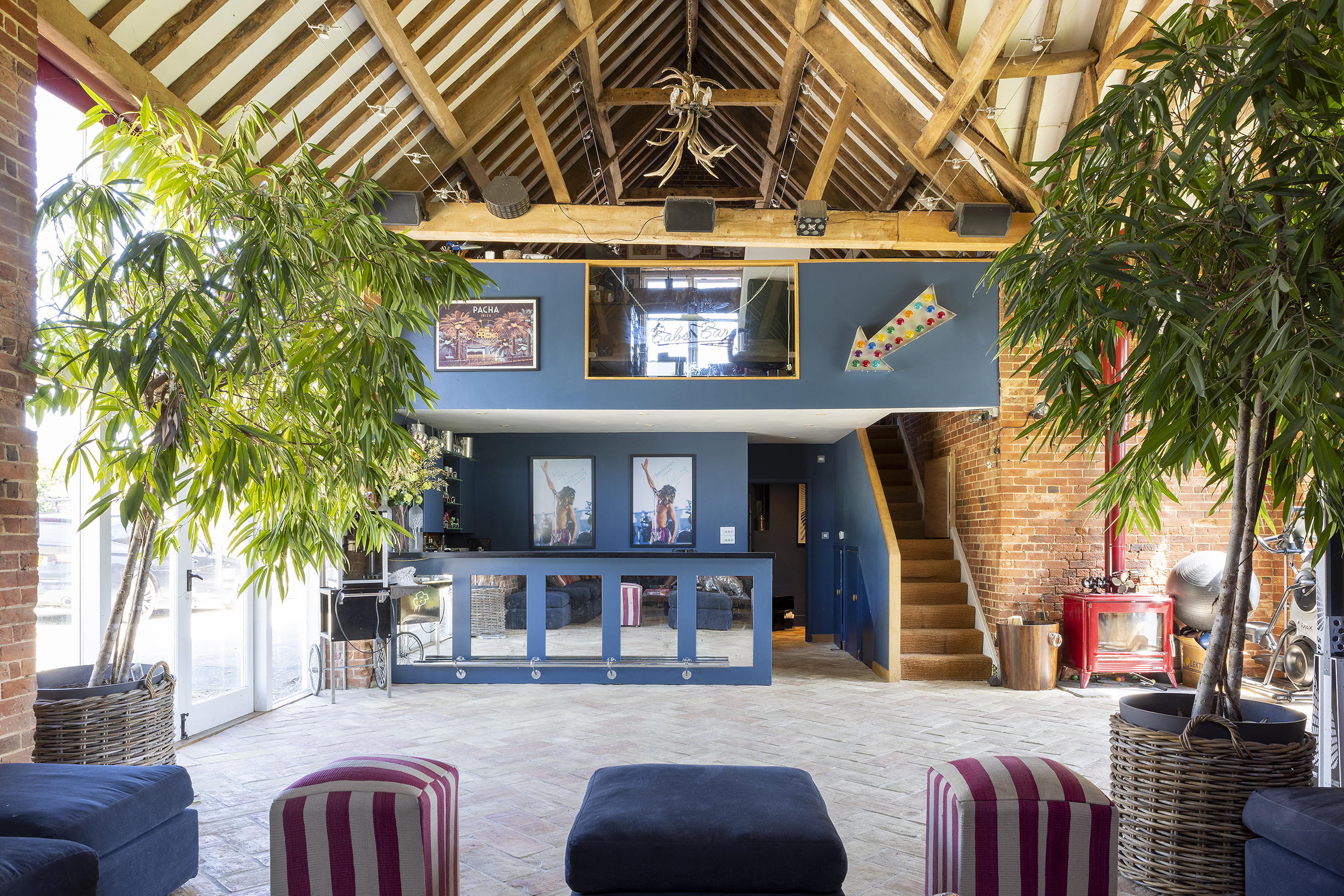 Mount Farm's party barn painted blue, complete with indoor bar and staircase