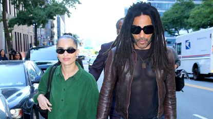 Zoë Kravitz with Lenny Kravitz wearing an oversized green button-up shirt with baggy jeans and black sneakers in New York City September 2024