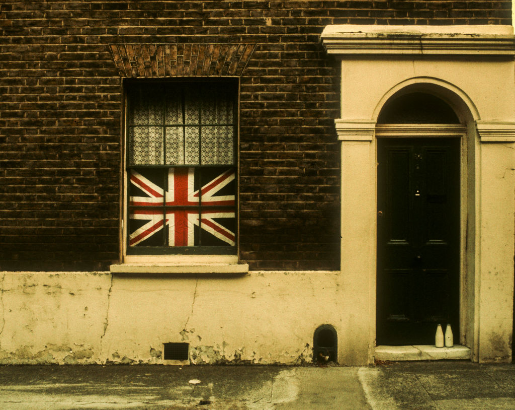 Stagflation - a grimy old house with a union jack in the window