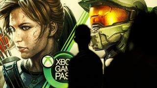 Attendees walk past Microsoft Corp. Xbox Game Pass signage