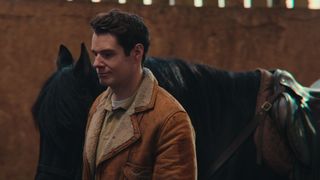 Connor Swindells as Adam Groff with a horse in Sex Education season 4