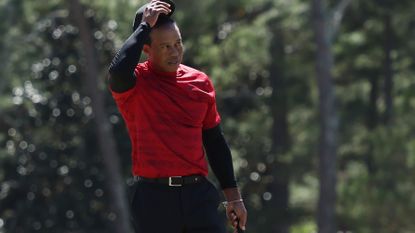 Tiger Woods tips his hat to the crowd after his final round at the 2022 Masters
