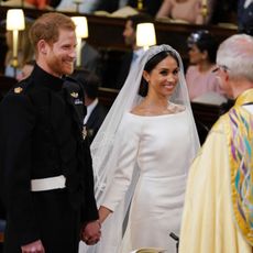 meghan markle and prince harry in front of the archbishop of canterbury
