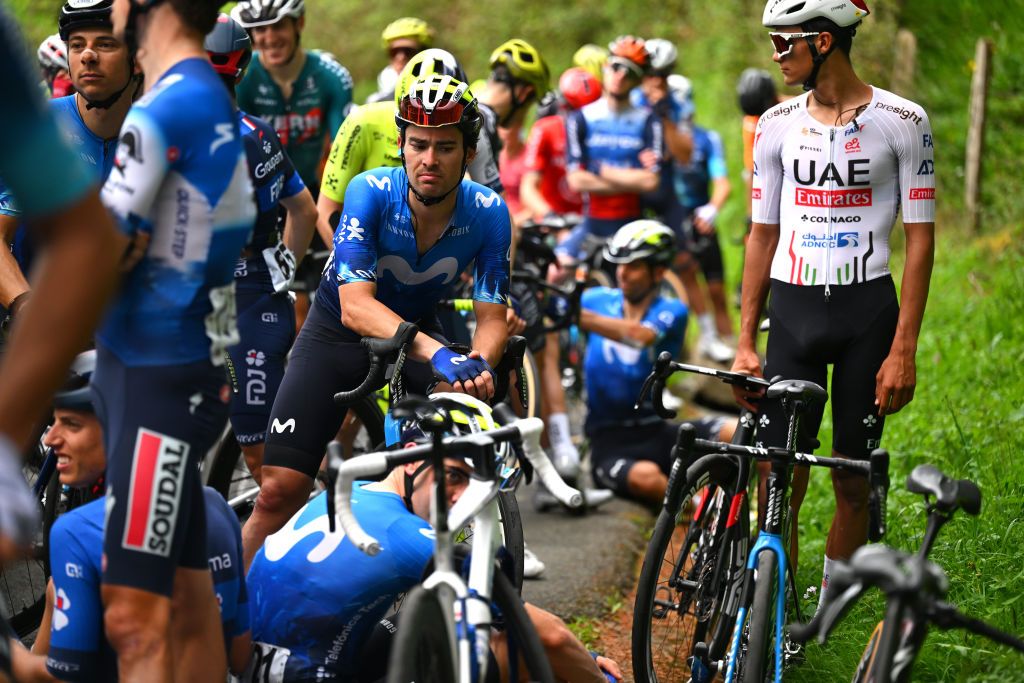 LEGUTIO SPAIN APRIL 04 LR Gonzalo Serrano of Spain and Movistar Team Isaac del Toro of Mexico and UAE Team Emirates and a general view of the peloton waiting at Olaeta 582m after the neutralisation of the race due to a multiple crash during the 63rd Itzulia Basque Country 2024 Stage 4 a 1575km stage from Etxarri Aranatz to Legutio 550m Race neutralised due to a multiple riders crash and dropouts The breakaway will dispute the victory UCIWT on April 04 2024 in Etxarri Legutio Spain Photo by Tim de WaeleGetty Images