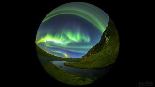 A full-dome, time-lapse image captured with a circular fisheye lens features a northern lights show above the cliffs of Seljalandsfoss, Iceland. 